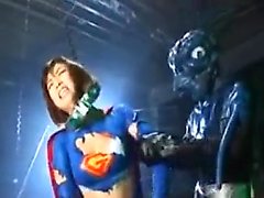 Super hero is put on a torture machine and an alien hurts h