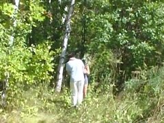 Mature woman having fun in the woods