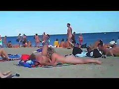 cuckolding in a topless beach gets recorded