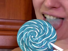 Hot MILF enjoys sucking on a lollipop