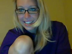 Attractive blonde geek influencing and stripteasing on cam