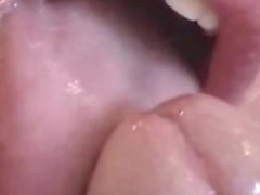 Beauty is giving a juicy blowjob in close-up