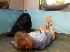 Susie hogtied on the tent floor