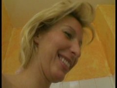 Horny blonde milf masturbating on the shower
