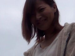 Asian rubbing outdoors