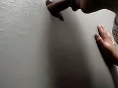 Mature woman at the glory hole sucking cock for cum